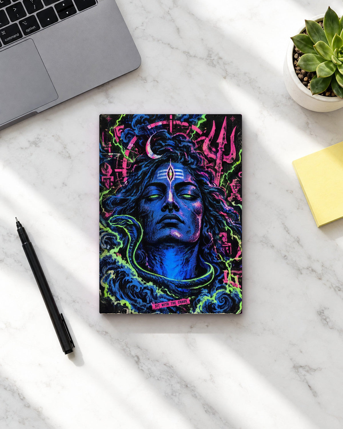 Sit With The Chaos – Shiva notebook, notebook on a marble desk